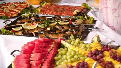 Buffet, guests put food on their plates 库存影片 247684493