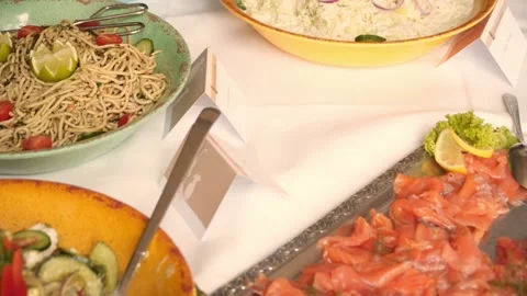 Buffet, guests put food on their plates 動画素材 247684512