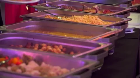 Buffet guests putting food on plates Vídeo Stock 277436445