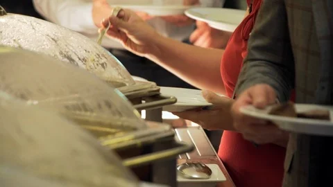 Buffet guests take food 4K 스톡 동영상 108161014