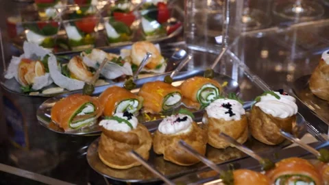Buffet for the holiday. decorated banquet table with appetizers canapes. Stock Footage 335345422