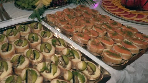 Buffet on the holiday Seafood, cheese, fruit and various sweets Stock Footage 123827313