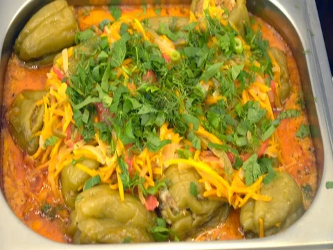 Buffet: hot stuffed peppers in sauce with herbs Stock Footage 80493697