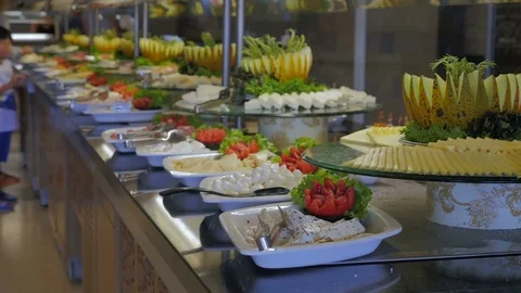 Buffet in the hotel, restaurant. People go to the table and pick up food Stock-Footage 80406045