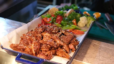 Buffet meat traychafing dish filled with juicy beef slices in rich gravy on the Video stock 322629776
