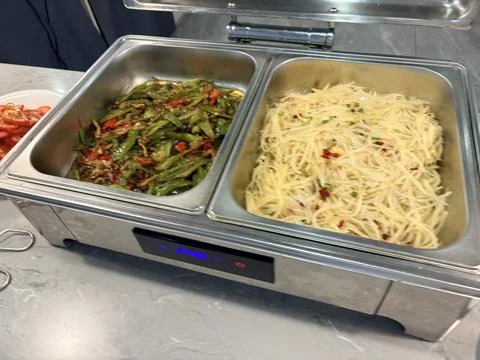 Buffet with pasta and vegetables. 스톡 사진