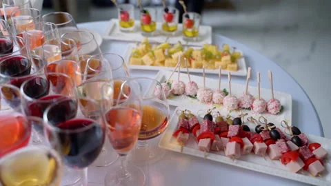 Buffet at the reception. Assortment of canapes. Banquet service Stock Footage 153437009