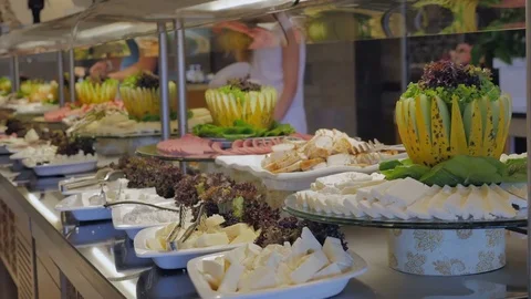 Buffet in the restaurant. Appetizer of cheese. Stock Footage 81344862