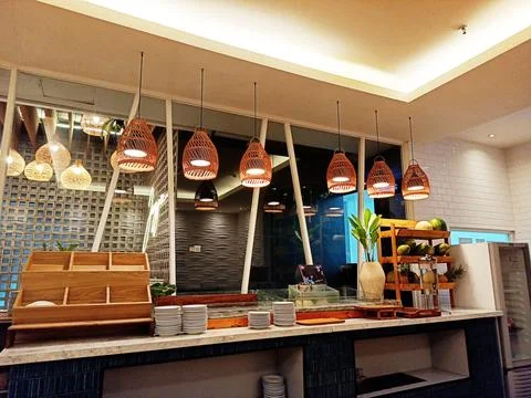 Buffet Restaurant Interior With Wicker Pendant Lights Stock Photos