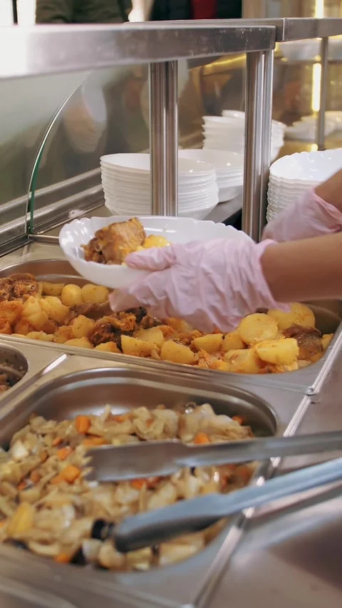 Buffet restaurant. self-service cafeteria. close-up. waitress, in protective Stock Footage 319292591