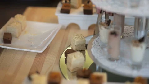 The buffet in the restaurant. The waiter puts the desserts on the dish Stock Footage 85645274