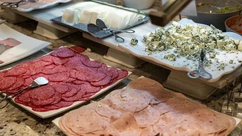 Buffet with Salami Ham Blue Cheese and Fresh Dairy Selection Фото