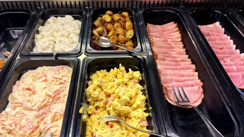 Buffet With Sliced Ham Salads and Roasted Potatoes Stock-Footage 340306359