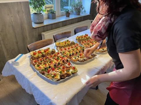 On the buffet small canaps are arranged Stock Photos