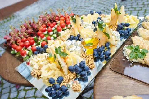 Buffet snacks, canapes placed on transparency plate. Stock Photos