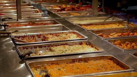 Buffet table at all you can eat restaurant. Hot and fresh food at a mall food   Stock Footage 103565619