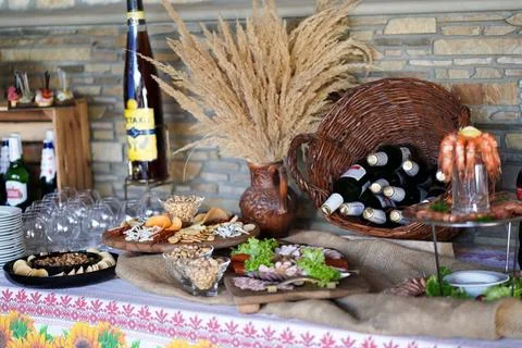 Buffet table with appetizers, seafood, wine and traditional decorations durin Stock Photos
