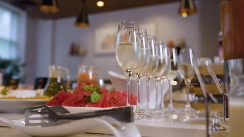 Buffet table with assorted drinks snacks and decorative ceramic fruits Stock Footage 341983622