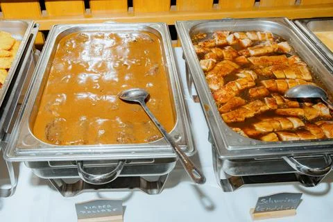 Buffet Table with Beef Roulade and Pork Loin Display Fotos Stock
