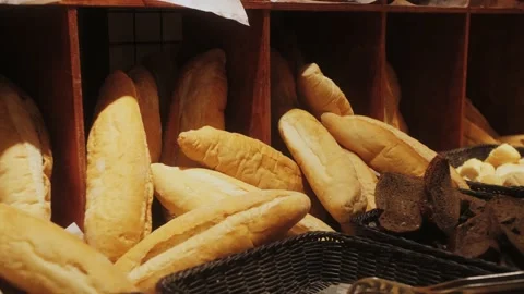 Buffet table with bread at the hotel restaurant. Crispy bread with whole wheat Stock Footage 217779628