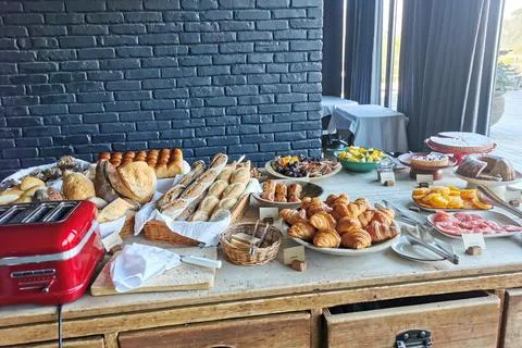 Buffet table with bread, pastries, fruit, nuts Foto stock