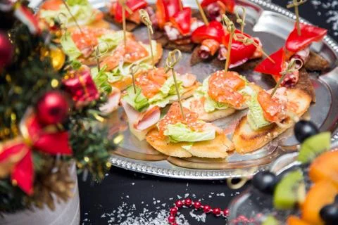 Buffet table with canape and red fish Фото