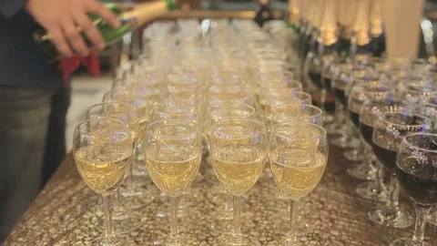 Buffet table, champagne is poured into glasses Stock Footage 72932029