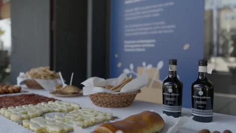 Buffet Table with Cheese Cured Ham Bread and Wine Bottles at an Event Stock Footage 343927167