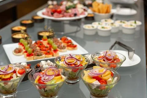 Buffet table with cold appetizers and salads. Фото