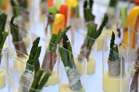 Buffet table with  cut vegetable hors d'oeuvres on a white tablecloth Stock Photos
