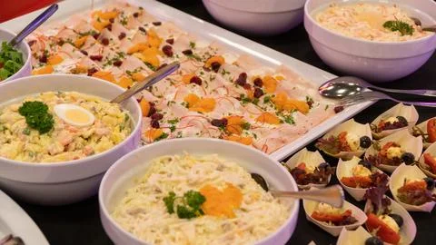 Buffet table different dishes are on the table Фото
