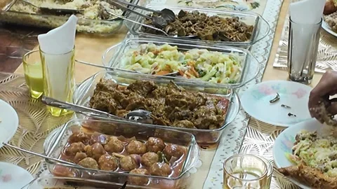 Buffet table display of diverse homemade food dishes served in glass trays .. Stock Footage 332578984