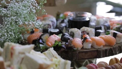 A buffet table featuring sushi and sweets Stock-Footage 321014735