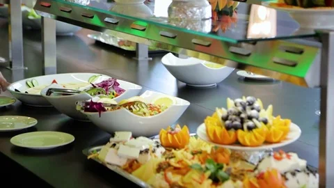 A buffet table with fruit and pastries Stock Footage 76426814