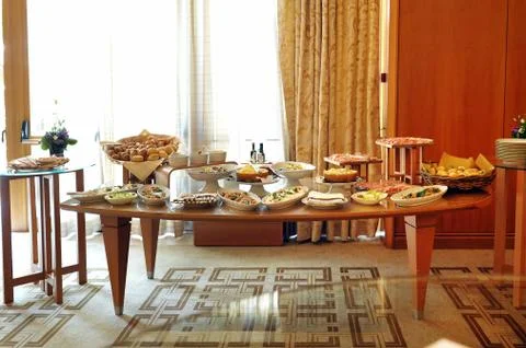 Buffet table laden with a selection of food Stock Photos
