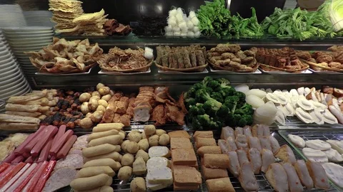 Buffet Table with Meats and Vegetables at a Restaurant in Singapore Stockbeeldmateriaal 73877190