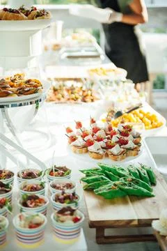Buffet table of reception with cold snacks, meat and salads Foto stock