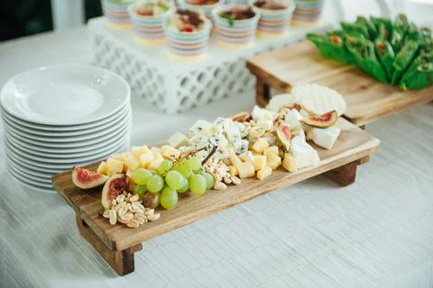 Buffet table of reception with cold snacks, meat and salads Stock Photos