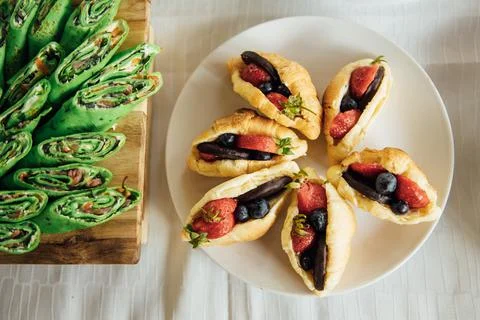 Buffet table of reception with cold snacks, meat and salads Stock Photos