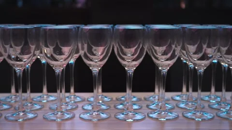 Buffet table with rows of glasses for events Stock Footage 315097699