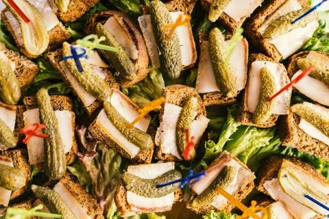 Buffet table with sandwiches of rye bread, lard and pickled cucumbers Fotos Stock