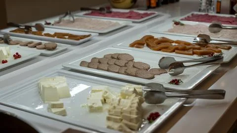 Buffet Table With Sliced Cold Cuts Cheese And Butter Stock Photos