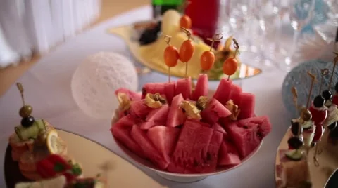 A buffet table with a snack and a drink. Stock Footage 65331777