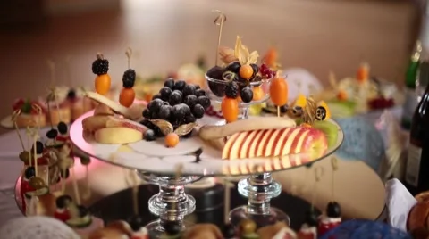 A buffet table with a snack and a drink. Stock Footage 65331804