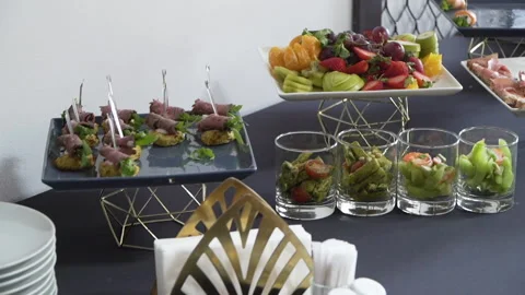 Buffet table with snacks on skewers 스톡 동영상 160687551