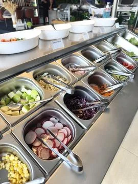 Buffet table stocked with an array of salads and veggies Foto stock