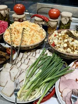 Buffet table with traditional appetizers and scallion Stock Photos