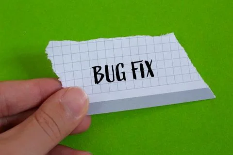 Bug fix words written on ripped paper with green background. Conceptual bug f Stock Photos