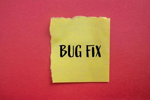 Bug fix words written on ripped yellow paper piece with red background. Conce Stock Photos