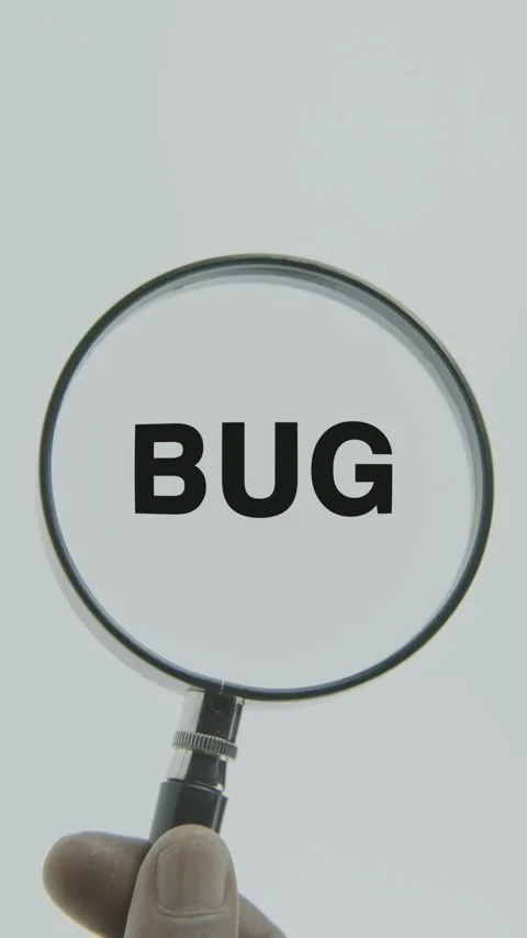 Bug text or word highlighted by a magnifying glass in a hand on a white Stock Footage 303414896